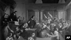 FILE - This image by the Library of Congress shows the painting "Trial of George Jacobs of Salem for Witchcraft" in 1692. From the Salem witch trials to the Red Scare to QAnon, conspiracy theories have served as dark alternatives to traditional history taught in school books.