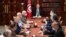Tunisia's President Kais Saied, center, leads a security meeting with members of the army and police forces in Tunis, July 25, 2021. 