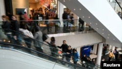 FILE - Holiday shoppers look for deals at the Pentagon City Mall in Arlington, Virginia, Nov. 29, 2019. 