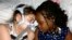 Sarah Murnaghan, left, lies in her hospital bed next to adopted sister Ella on the 100th day of her stay in Children's Hospital of Philadelphia, (File photo).