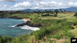 FILE - A golf course is seen in Lihue, Hawaii, on the east side of Kauai, Nov. 15, 2018. A tour helicopter that took off Dec. 26, 2019, from Lihue with seven people on board has gone missing.