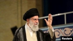 FILE - Iran's Supreme Leader Ayatollah Ali Khamenei waves during ceremony attended by Iranian clerics in Tehran, July 16, 2019.