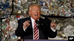 FILE - Then-presidential candidate Donald Trump speaks during a campaign stop at Alumisource, a metals recycling facility in Monessen, Pa., June 28, 2016. Trump has broken with decades of conservative economic thinking on the value of free trade.