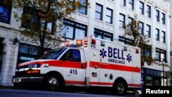 A Bell Ambulance speeds through the Bronzeville neighborhood on the North Side of Milwaukee, as the coronavirus disease (COVID-19) outbreak continues in Wisconsin, Nov. 6, 2020. 