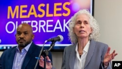 Los Angeles County Department of Public Health experts, Muntu Davis, Health Officer, left, and Director Dr. Barbara Ferrer answer questions regarding the measles response and the quarantine orders during a news conference in Los Angeles Friday, April 26, 2019. 