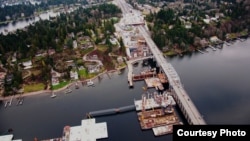 The new SR 520 floating bridge takes shape next to the current bridge in Medina, Washington. Nearly 100 foreign investors, mostly from China, purchased municipal bonds in this project to qualify for U.S. green cards. (Photo courtesy WSDOT)