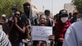 FILE: In an earlier protest, demonstrators decry military rule in Khartoum, Sudan, March 24, 2022. Sudan has seen many protests held since the coup that put General al-Burhan in charge of the East African nation. 