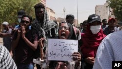 FILE: In an earlier protest, demonstrators decry military rule in Khartoum, Sudan, March 24, 2022. Sudan has seen many protests held since the coup that put General al-Burhan in charge of the East African nation. 