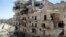 A view of a street with damaged buildings in Aleppo's Salaheddine neighborhood, July 9, 2013.