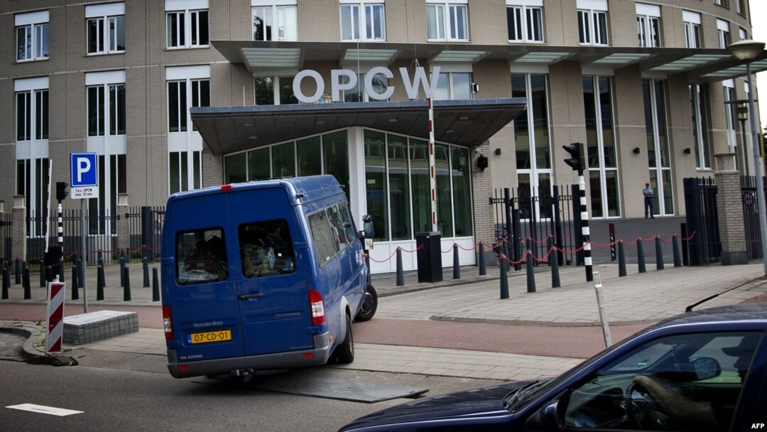 United Nations inspectors arrive in a van at the headquarters of the Organisation for the Prohibition of Chemical Weapons (OPCW), in The Hague, Aug. 31, 2013. 