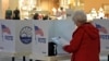 Delores Engel looks over her ballot while voting at the West Ridge Mall in Topeka, Kansas, Nov. 5, 2024.