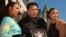 FILE: US former world heavyweight boxing champion Muhammad Ali (C) poses with two of his daughters, Hana (L) and May May (R), after a star was unveiled for him on the Hollywood Walk of Fame, in Los Angeles, CA, 11 January 2002. 