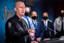 Captain Jay Baker of the Cherokee County Sheriff's Office speaks to the news media during a briefing after the fatal shootings of eight people, at the Atlanta Public Safety Headquarters in Atlanta, Georgia, March 17, 2021.