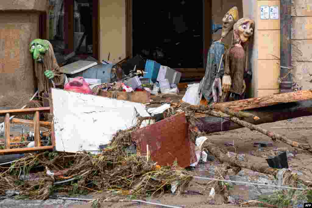 Debris is seen next to a damaged building following the floods from Storm Boris, in Ladek-Zdroj, southern Poland.