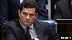 FILE - Brazilian federal judge Sergio Moro reacts during a session at the Federal Senate in Brasilia, Brazil, Dec. 1, 2016.