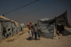 Children of IS fighters have few - if any memories- of life without war or extremism. Aid organizations say they must be urgently helped and "cared for as children," pictured on Aug. 26, 2019 in al-Hol Camp, Syria. (VOA/Yan Boechat)