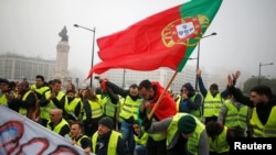 Protesters are seen during a demonstration by the "yellow vests" movement in Lisbon, Portugal, December 21, 2018. 