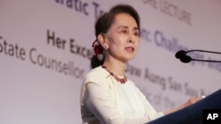 Myanmar's leader Aung San Suu Kyi delivers a lecture titled "Myanmar's Democratic Transition: Challenges and Way Forward" at the 43rd Singapore Lecture organized by the Institute of South East Asian Studies or ISEAS Yusof Ishak Institute, Aug. 21, 2018, in Singapore.