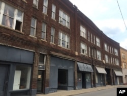 This May 10, 2016 photo shows shuttered storefronts in downtown Logan, West Virginia. The unemployment rate is 11 percent, compared to 4.7 percent nationwide.