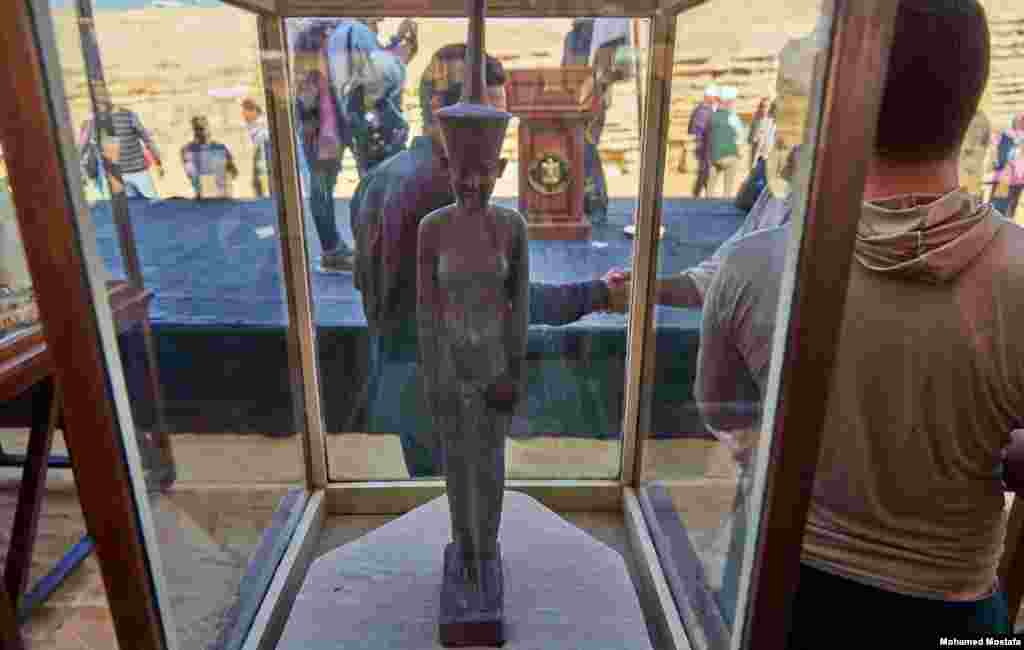 A beautifully carved statue of Neith, the goddess of war, protection, and the hunt. The Lower Egyptian deity is aptly depicted wearing the Red Crown of Lower Egypt. (H. Elrasam/VOA)