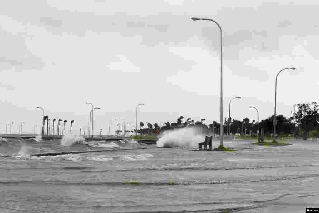 Water floods an area outside the levee system along the shore of Lake Pontchartrain as tropical storm Isaac approaches New Orleans, Louisiana, August 28, 2012. 