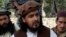 Pakistani Taliban chief Hakimullah Mehsud sits with other millitants, South Waziristan, Oct. 4, 2009.