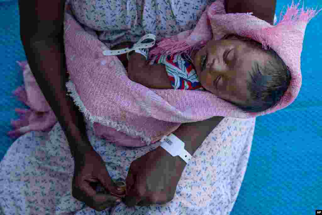 Terhas Tsfa, 25, who gave birth on a street as she fled the conflict in Ethiopia&#39;s Tigray region, holds her baby at Um Rakuba refugee camp in Qadarif, eastern Sudan, Nov. 23, 2020.