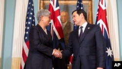 Australia's Foreign Minister Penny Wong, left, shakes hands with Secretary of State Marco Rubio, at the State Department, Jan. 21, 2025, in Washington.