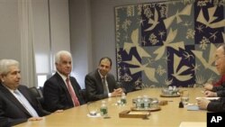 United Nations Secretary- General Ban Ki-moon, right, meets Cypriot President Demetris Christofias, left, and Turkish Cypriot leader Dervis Eroglu, second from left, Thursday, Nov. 18, 2010 at United Nations headquarters. (file)