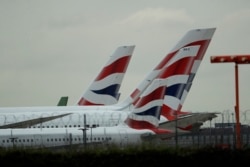 FILE - British Airways planes sit parked at Heathrow Airport in London, Sept. 9, 2019.