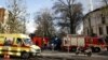 Belgian firefighters stand outside the Grand Mosque in Brussels, Belgium, Nov. 26, 2015, after a powder feared to be Anthrax was found.