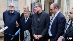 Grand Rabbi of France Haim Korsia (2ndL), flanked by rector of the Great Mosque of Paris, Chems-eddine Hafiz (L), Archbishop of Reims, Eric de Moulins-Beaufort (C) President of the Protestant Federation of France, Christian Krieger (2ndR), in Paris on November 13, 2023.