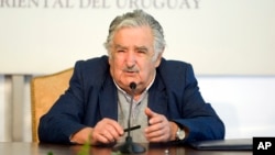 FILE - Uruguay's President Jose Mujica speaks during a news conference the presidential house Residencia de Suarez y Reyes, in Montevideo, Sept. 12, 2014.