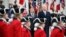 President Donald Trump and French President Emmanuel Macron stand during a State Arrival Ceremony on the South Lawn of the White House in Washington, April 24, 2018.