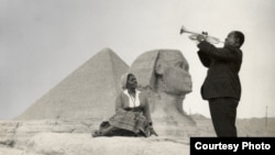 Louis Armstrong and his wife Lucille pose in front of the Sphinx near Cairo, Egypt in 1961. Credit: Courtesy of the Louis Armstrong House Museum