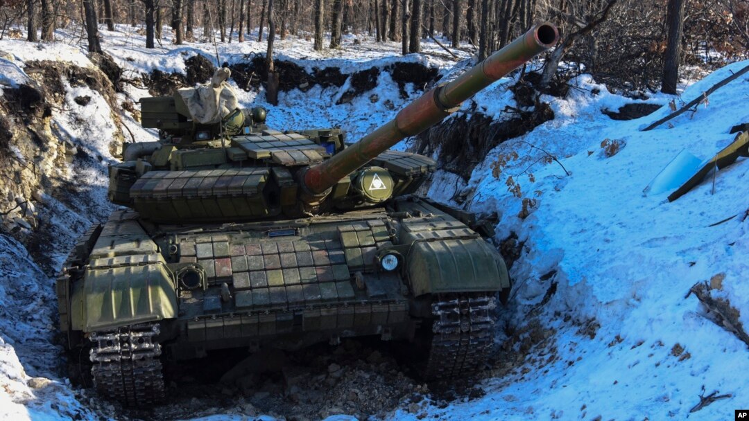 A pro-Russia separatists' tank is seen in a fortified position at a check-point north of Luhansk, eastern Ukraine, Jan. 14, 2015.