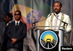 FILE - Ethiopia's Prime Minister Abiy Ahmed addresses his country's diaspora, the largest outside Ethiopia, calling on them to return, invest and support their native land with the theme "Break The Wall Build The Bridge", in Washington, July 28, 2018.