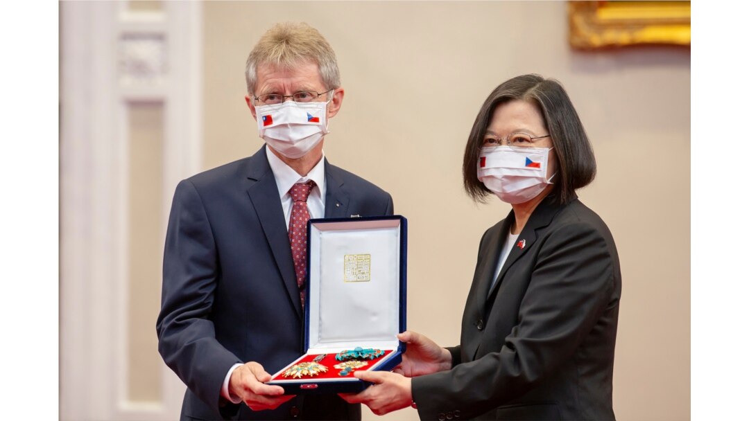 In this photo released by the Taiwan Presidential Office, the Czech Senate President Milos Vystrcil is presented a medal by Taiwanese President Tsai Ing-wen during a meeting in Taipei, Taiwan, Sept. 3, 2020.