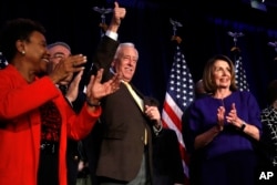 House Minority Leader Nancy Pelosi of Calif., right, steps away from the podium as House Minority Whip Steny Hoyer, D-Md., makes the thumbs up sign, after Pelosi spoke about Democratic gains in the House of Representatives to a crowd of Democratic supporters during an election night returns event at the Hyatt Regency Hotel, on Tuesday, Nov. 6, 2018, in Washington.