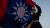 FILE - An honor guard takes part in a flag-lowering ceremony at Chiang Kai Shek Memorial Hall in Taipei, Taiwan, on Jan. 12, 2024. The Taiwan High Court on Aug. 23, 2024, sentenced eight military officers to prison for spying.