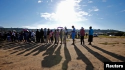 Locals wait to cast their votes during Lesotho's national elections in Magkhoakhoeng village, outside the capital, Maseru, Feb. 28, 2015. 