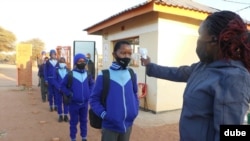 Students in Gaborone are checked for temperature before lessons start as part of new health regulations. (Photo: Mqondisi Dube)