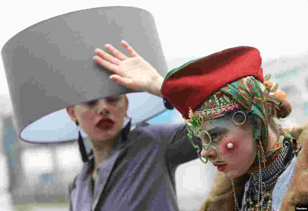 Participants take part in a &#39;Hat Walk&#39; during London Hat Week in London.