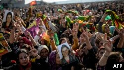 Kurds celebrating success by Kurd and peshmerga fighters to drive Islamic State militants out of Kobani. (Jan. 27, 2015.)