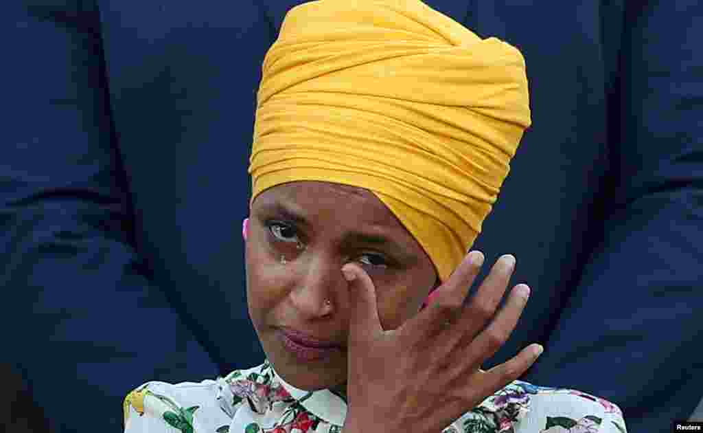 Rep Ilhan Omar (D-MN) wipes her tears as members of Congress observe a moment of silence for the 600,000 American lives lost to the COVID-19, outside the U.S. Capitol in Washington, D.C., June 14, 2021.
