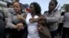 Berta Soler, leader of The Ladies in White, an opposition group, is detained by Cuban security personnel after a weekly anti-government protest march, in Havana, Sept. 13, 2015.
