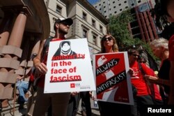 Protesters gather before a rally by the right-wing Patriot Prayer group in Portland, Ore., Aug. 4, 2018.