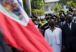 Haiti's President Jovenel Moise (R) and First Lady Martine Moise attend celebrations for the 217th anniversary of the Battle of Vertieres, the last major battle of Haitian independence from France, in Port-au-Prince, Haiti, Nov. 18, 2020.