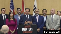 Florida Gov. Ron DeSantis gives his opening remarks - prior to signing legislation that seeks to punish social media companies that remove “conservative ideas” from their networks - in Miami on Monday, May 24, 2021. (Carl Juste/Miami Herald via AP)