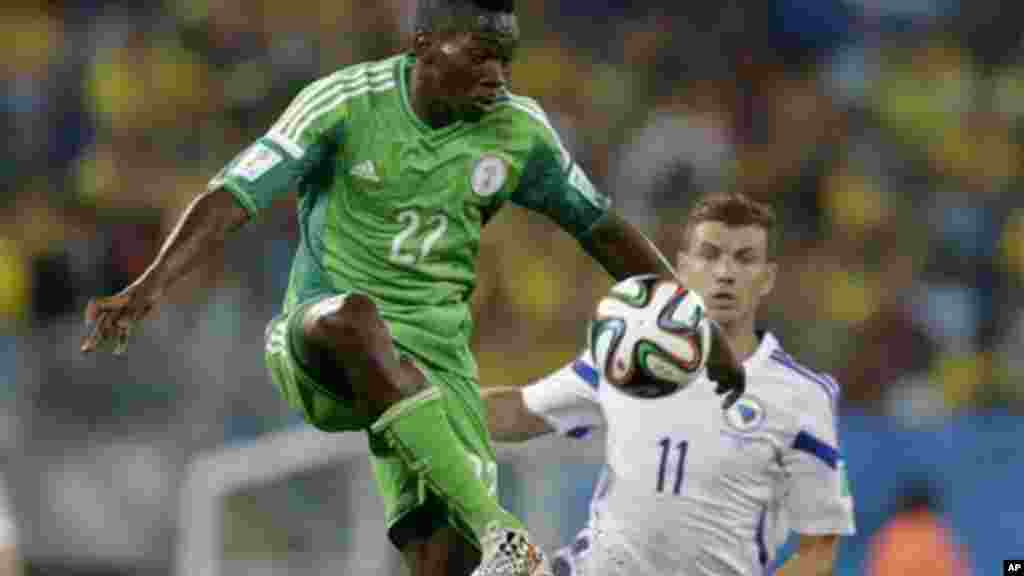 Nigeria's Kenneth Omeruo clears the ball from Bosnia's Edin Dzeko.